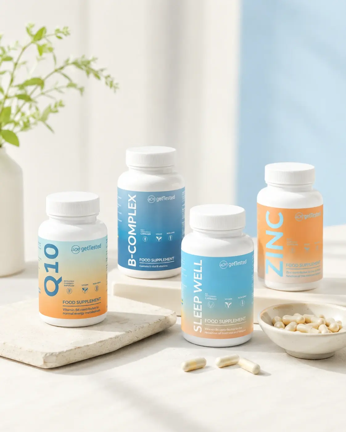 gettested supplement lineup: Q10, B-Complex, Sleep Well and Zinc bottles